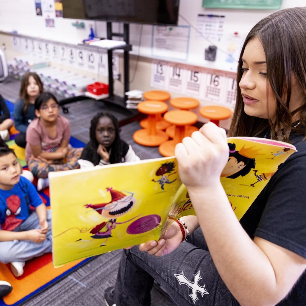  A South High student reads a book to an elementary school class